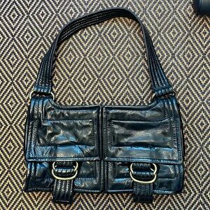 Vintage Y2K Kooba black patent baguette shoulder bag with gold tone buckles